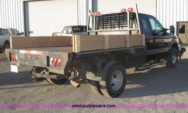 image for item B5400 1999 Ford F350 XLT SuperCab flatbed truck