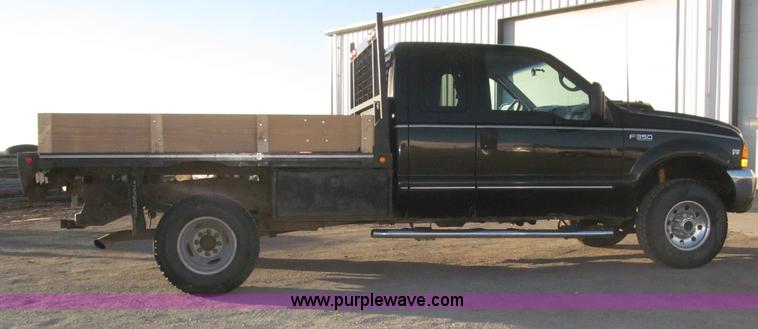 image for item B5400 1999 Ford F350 XLT SuperCab flatbed truck
