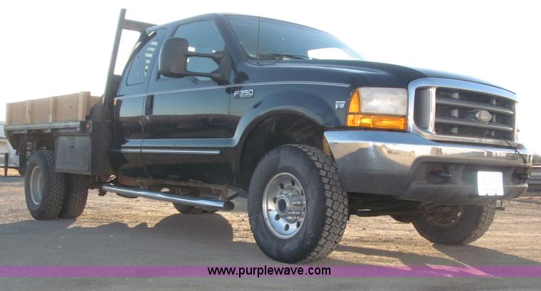 image for item B5400 1999 Ford F350 XLT SuperCab flatbed truck