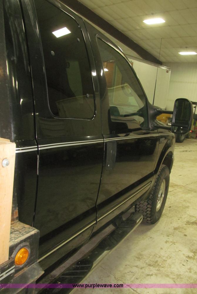 image for item B5400 1999 Ford F350 XLT SuperCab flatbed truck