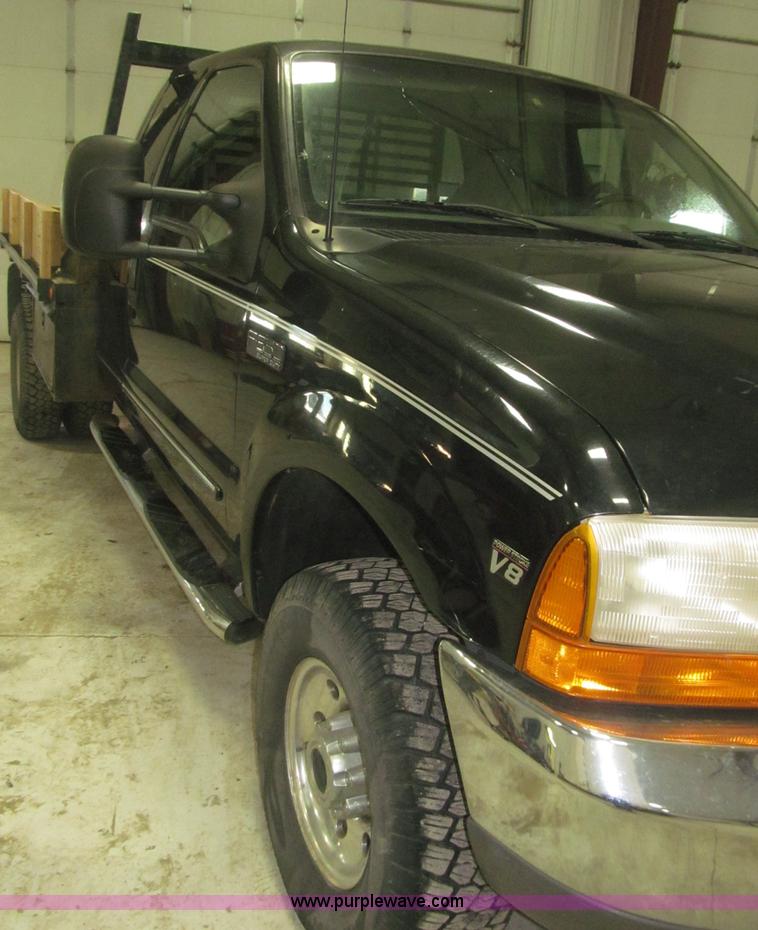 image for item B5400 1999 Ford F350 XLT SuperCab flatbed truck