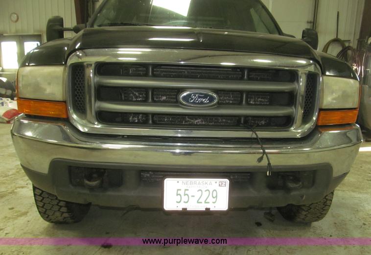 image for item B5400 1999 Ford F350 XLT SuperCab flatbed truck