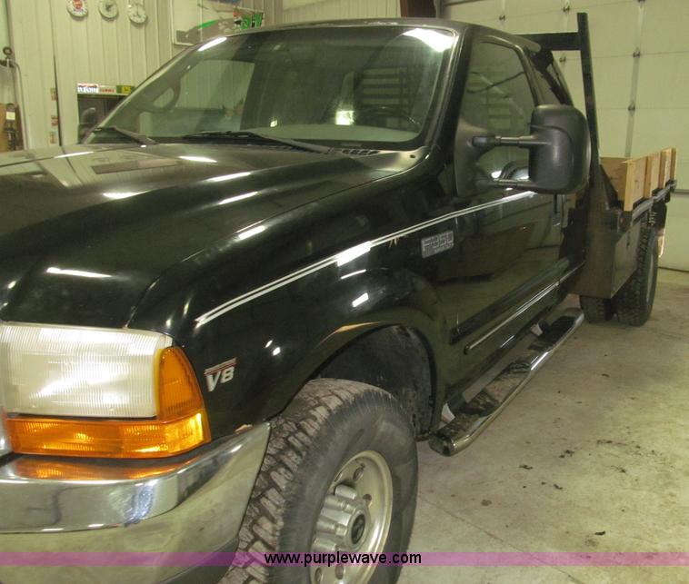 image for item B5400 1999 Ford F350 XLT SuperCab flatbed truck