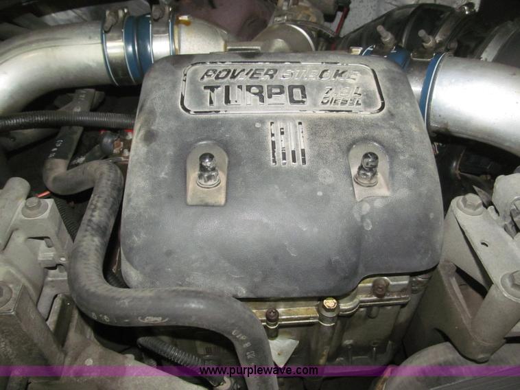 image for item B5400 1999 Ford F350 XLT SuperCab flatbed truck