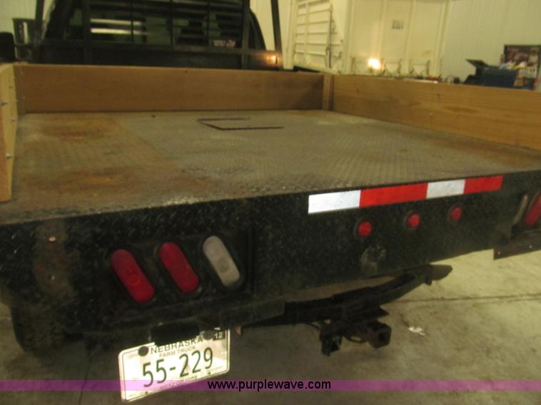 image for item B5400 1999 Ford F350 XLT SuperCab flatbed truck