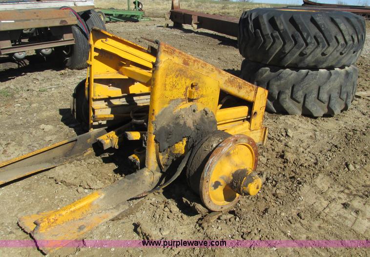 image for item X9869 Two tires and rear frame/punched off of pull-type scraper