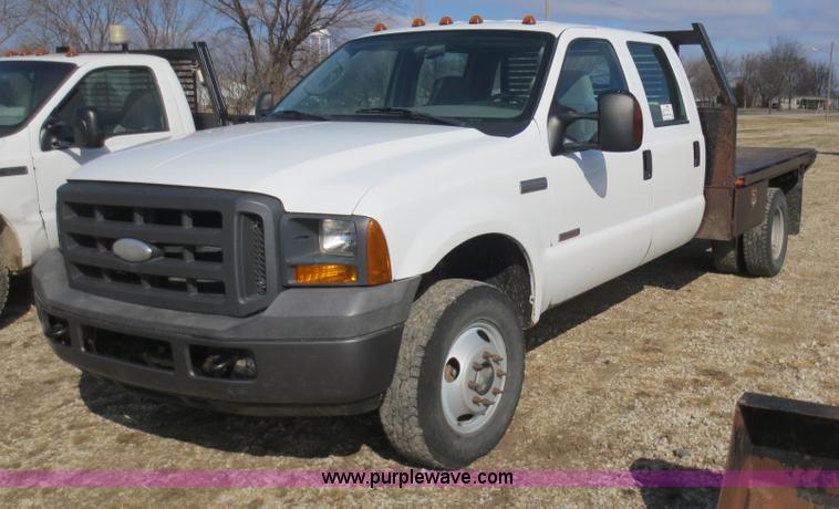 image for item F6611 2005 Ford F350 Super Duty Crew Cab flatbed truck