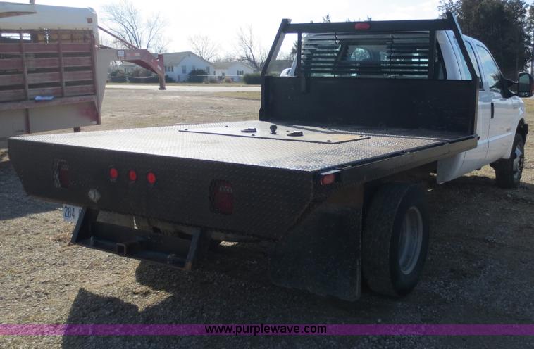 image for item F6611 2005 Ford F350 Super Duty Crew Cab flatbed truck