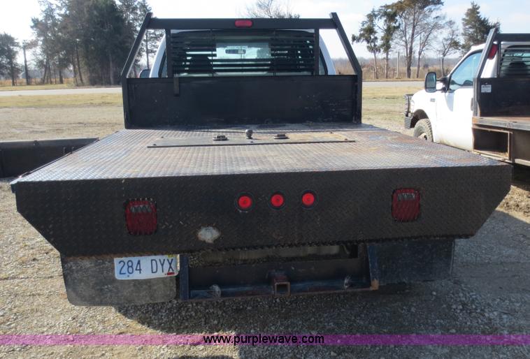 image for item F6611 2005 Ford F350 Super Duty Crew Cab flatbed truck