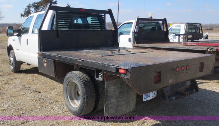 image for item F6611 2005 Ford F350 Super Duty Crew Cab flatbed truck