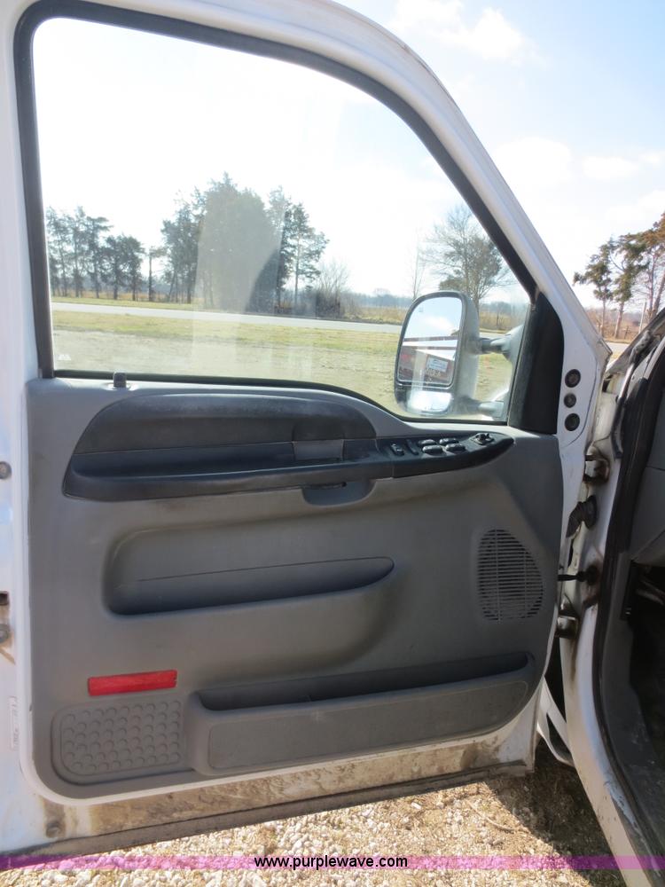 image for item F6611 2005 Ford F350 Super Duty Crew Cab flatbed truck