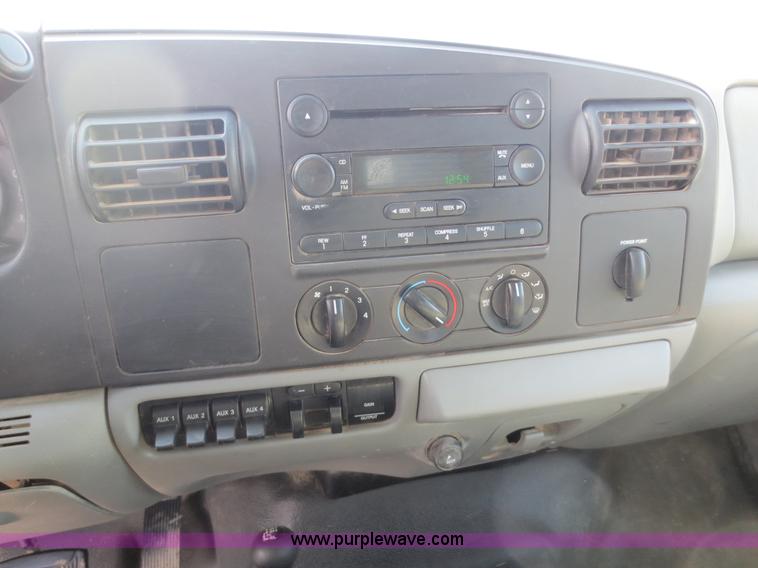 image for item F6611 2005 Ford F350 Super Duty Crew Cab flatbed truck