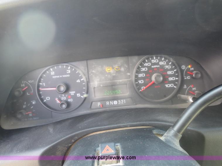 image for item F6611 2005 Ford F350 Super Duty Crew Cab flatbed truck