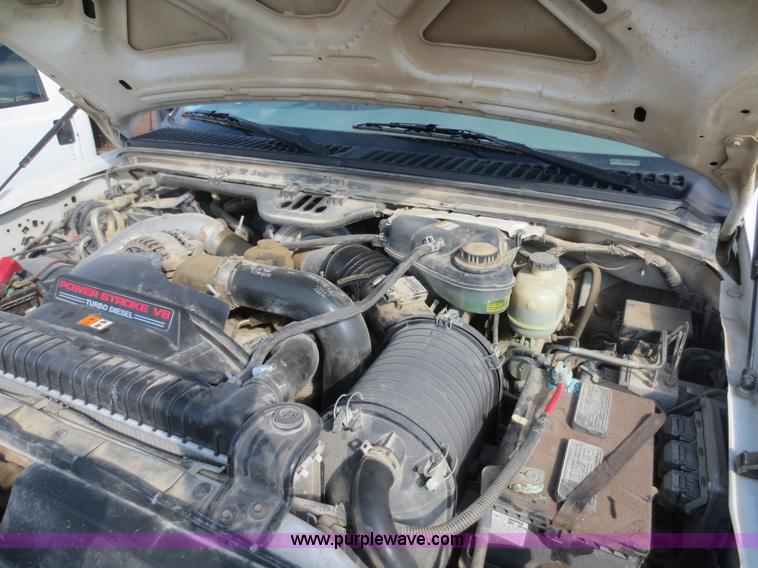 image for item F6611 2005 Ford F350 Super Duty Crew Cab flatbed truck