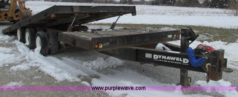 image for item F4762 1999 Dynaweld tilt flatbed triple axle trailer