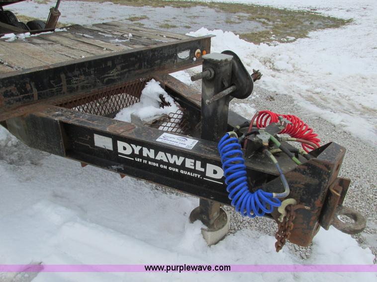 image for item F4762 1999 Dynaweld tilt flatbed triple axle trailer