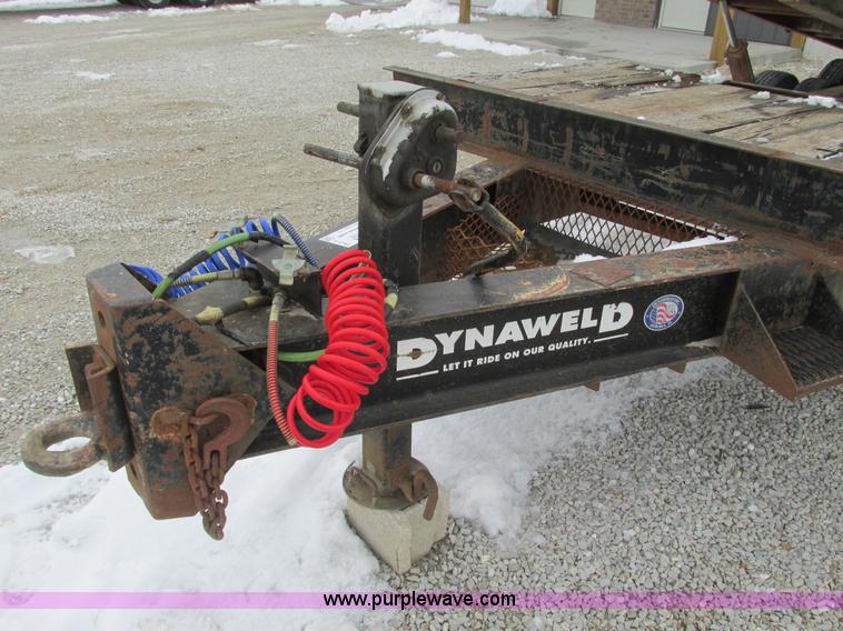 image for item F4762 1999 Dynaweld tilt flatbed triple axle trailer