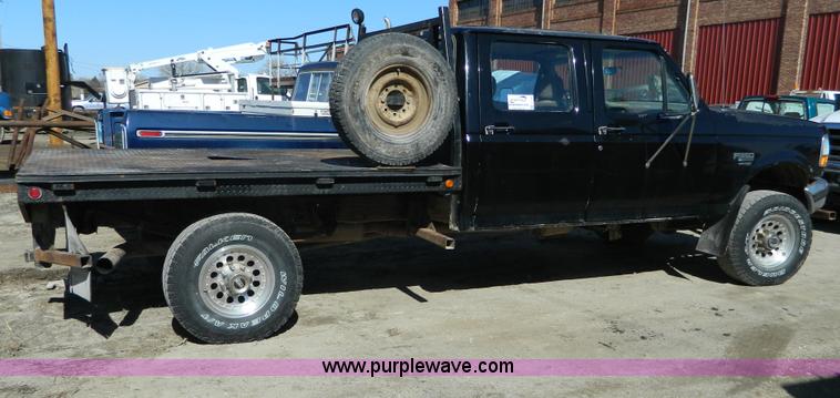 image for item G7786 1995 Ford F350 XL Crew Cab flatbed pickup truck