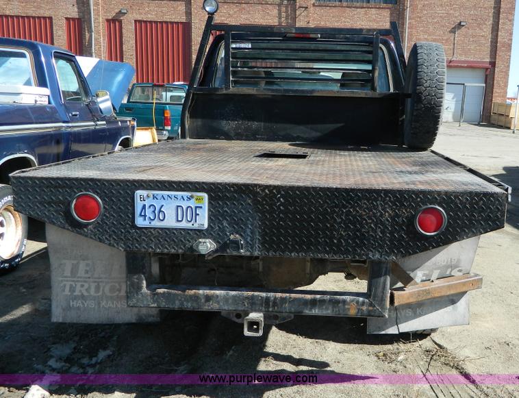 image for item G7786 1995 Ford F350 XL Crew Cab flatbed pickup truck