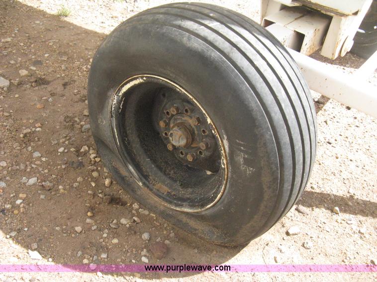 image for item E3220 Anhydrous ammonia tank on running gear