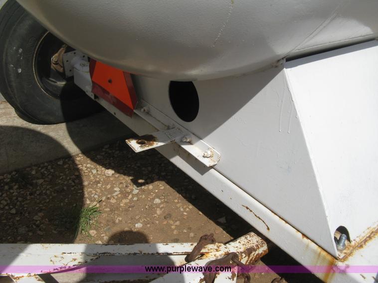 image for item E3223 Anhydrous ammonia tank on running gear
