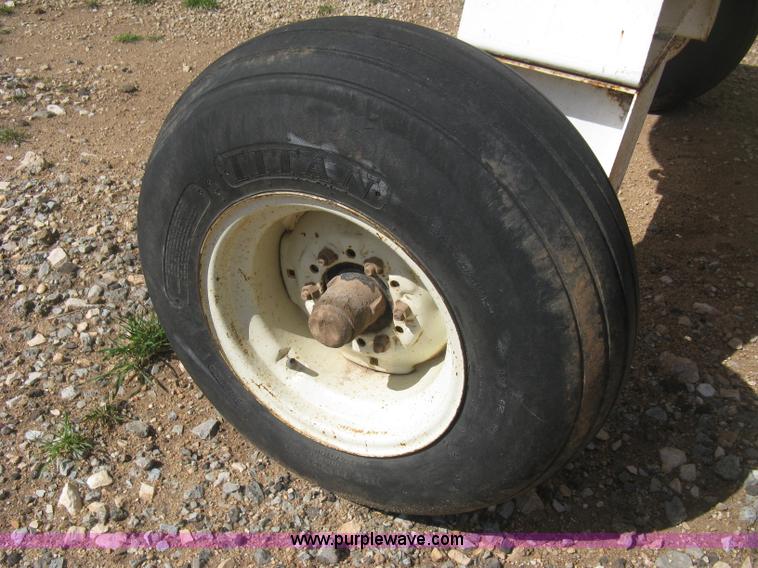 image for item E3224 Anhydrous ammonia tank on running gear