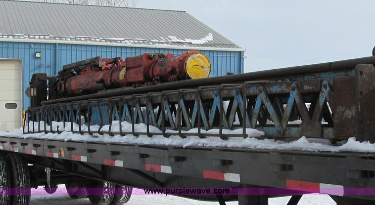 image for item G2573 2001 Delmag D12-42 pile driver and flatbed trailer
