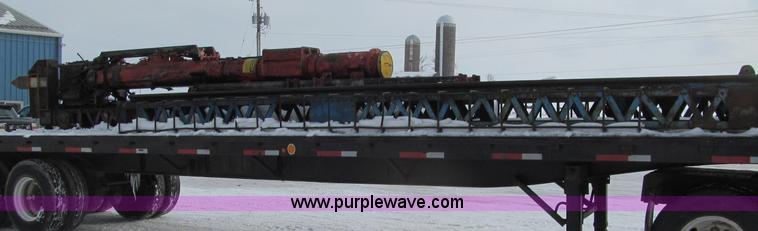 image for item G2573 2001 Delmag D12-42 pile driver and flatbed trailer