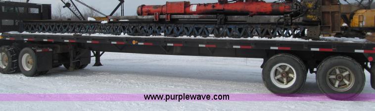 image for item G2573 2001 Delmag D12-42 pile driver and flatbed trailer
