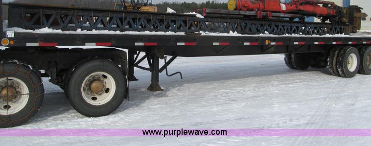 image for item G2573 2001 Delmag D12-42 pile driver and flatbed trailer
