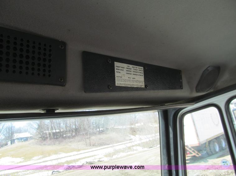 image for item D7250 2003 Freightliner FL80 Crew Cab tandem axle boom truck