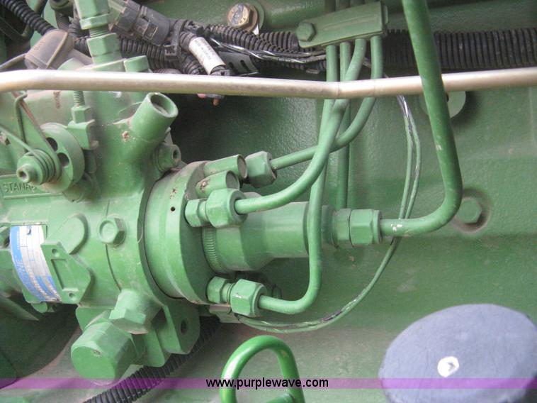 image for item E3358 2009 John Deere 6100D MFWD tractor