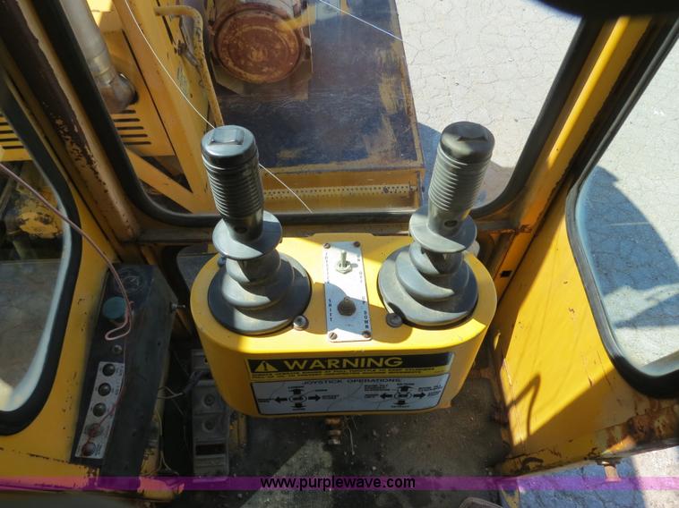 image for item B4701 Gradall G3WD rubber tire excavator