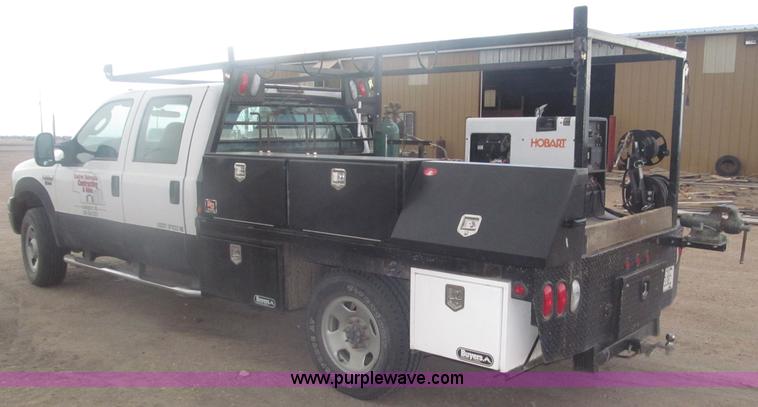 image for item B5424 2006 Ford F350 XL Super Duty CrewCab flatbed service truck