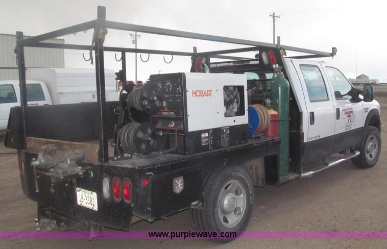 image for item B5424 2006 Ford F350 XL Super Duty CrewCab flatbed service truck