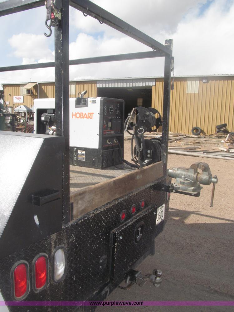 image for item B5424 2006 Ford F350 XL Super Duty CrewCab flatbed service truck