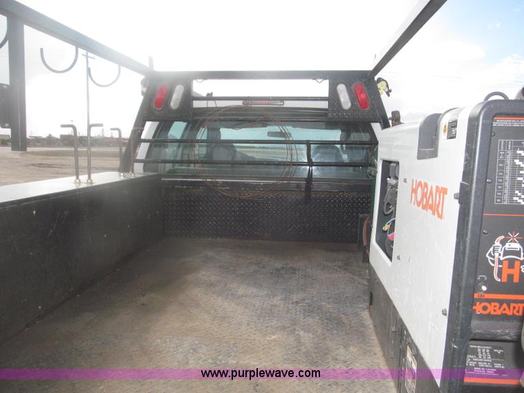 image for item B5424 2006 Ford F350 XL Super Duty CrewCab flatbed service truck