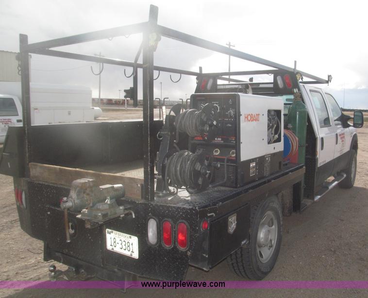 image for item B5424 2006 Ford F350 XL Super Duty CrewCab flatbed service truck