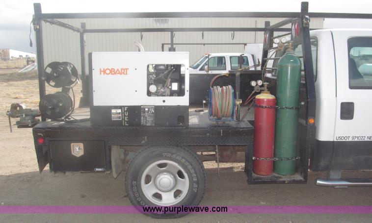 image for item B5424 2006 Ford F350 XL Super Duty CrewCab flatbed service truck