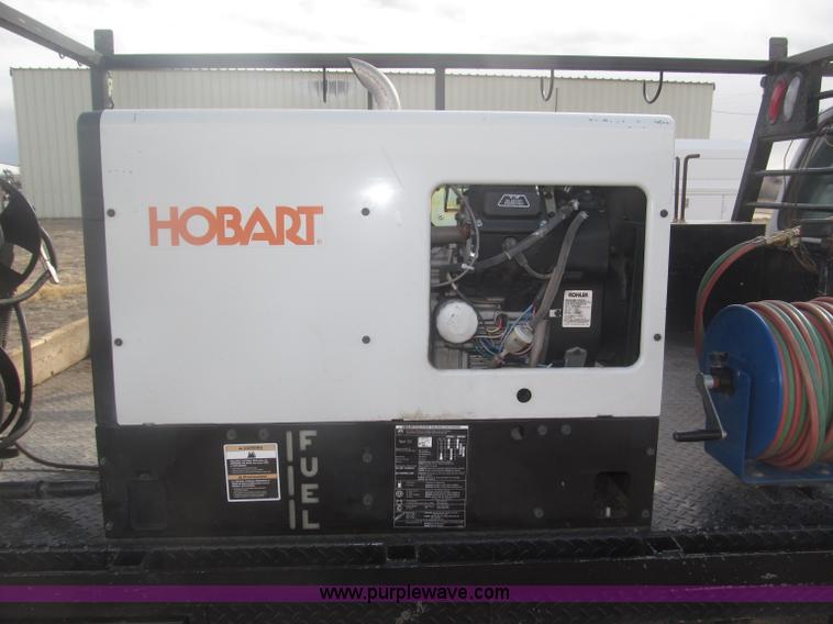 image for item B5424 2006 Ford F350 XL Super Duty CrewCab flatbed service truck