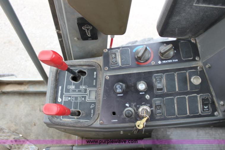 image for item E4315 Champion 720A Series IV articulated motor grader