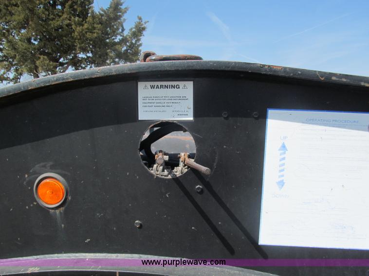 image for item E5968 1998 Fontaine 55 ton triple axel detach lowboy trailer