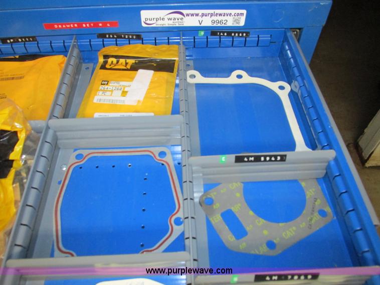 image for item V9962 Equipto parts bin and assorted Caterpillar parts