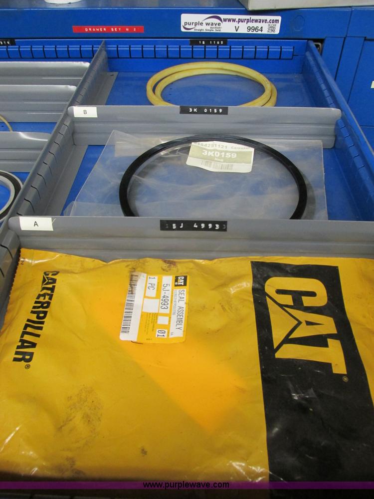 image for item V9964 Equipto parts bin and assorted Caterpillar parts