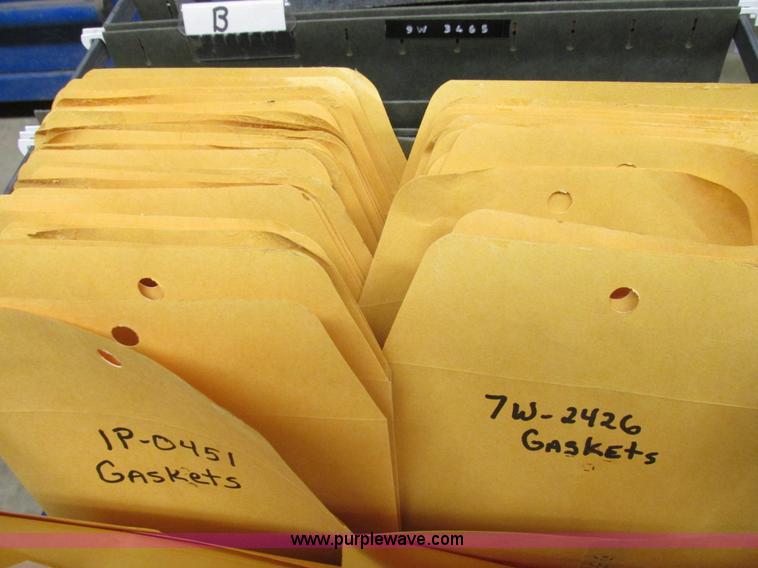 image for item V9964 Equipto parts bin and assorted Caterpillar parts