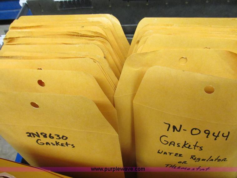 image for item V9964 Equipto parts bin and assorted Caterpillar parts