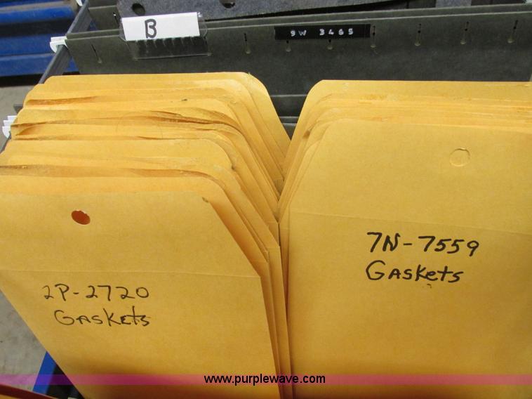 image for item V9964 Equipto parts bin and assorted Caterpillar parts