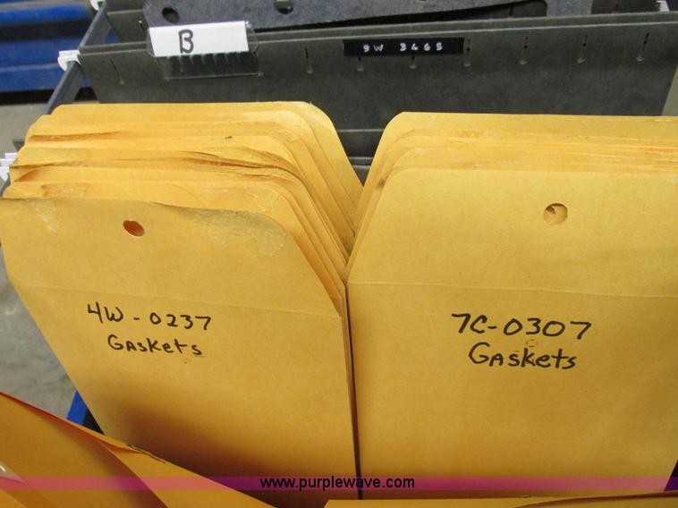 image for item V9964 Equipto parts bin and assorted Caterpillar parts