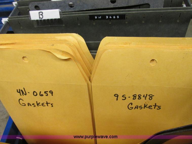 image for item V9964 Equipto parts bin and assorted Caterpillar parts