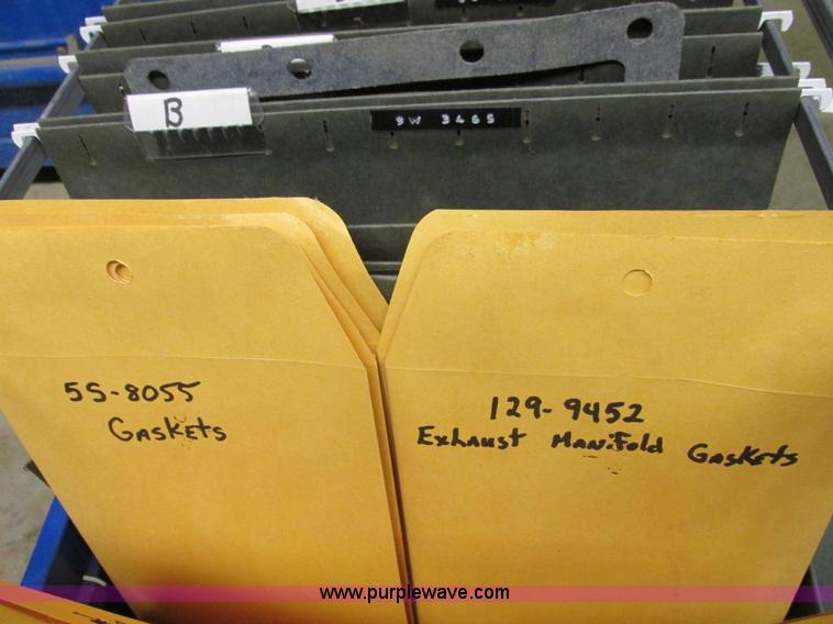 image for item V9964 Equipto parts bin and assorted Caterpillar parts